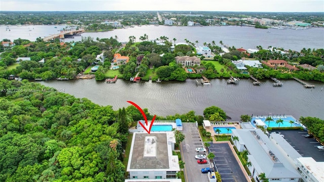 birds eye view of property featuring a water view