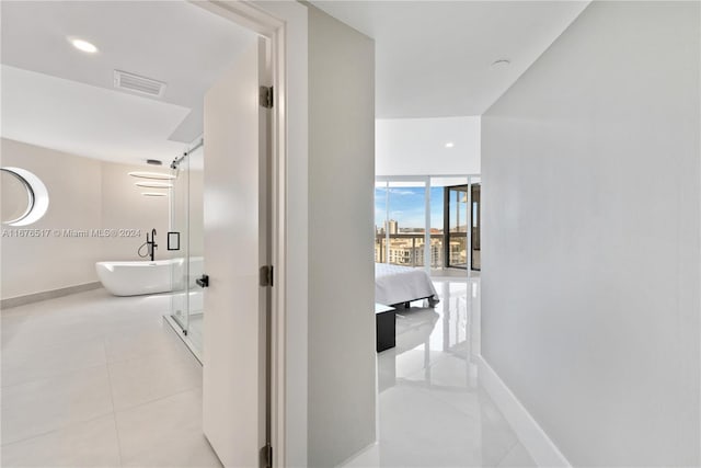 corridor with light tile patterned floors