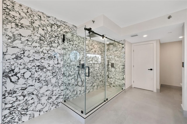 bathroom featuring concrete floors and an enclosed shower