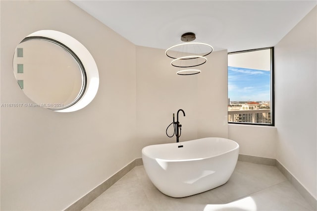 bathroom featuring tile patterned floors and a washtub