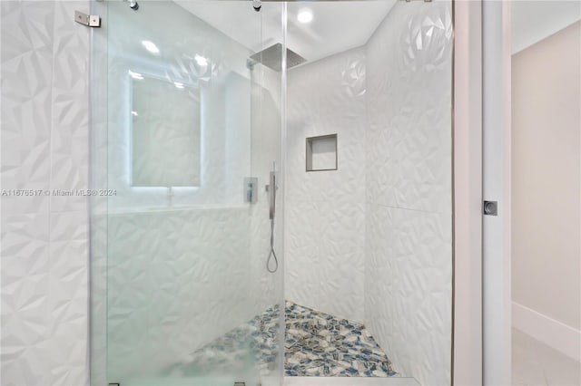 bathroom featuring an enclosed shower