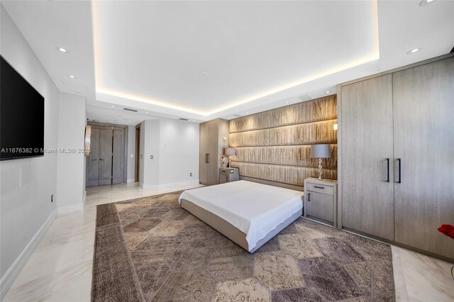 bedroom featuring a tray ceiling