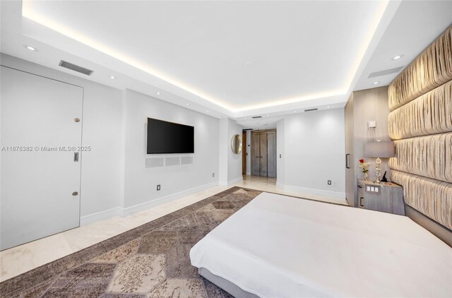 bedroom with a tray ceiling