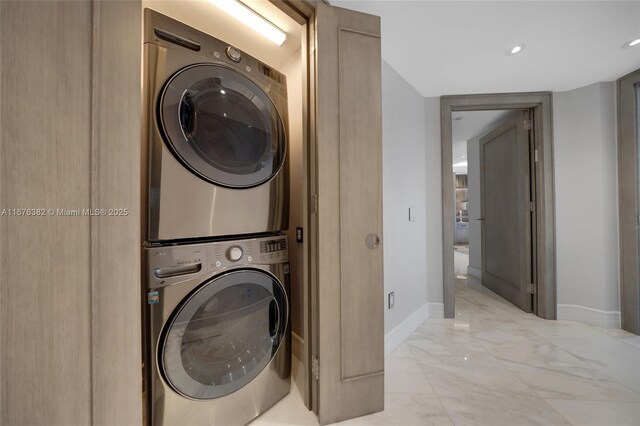 washroom with stacked washer / drying machine