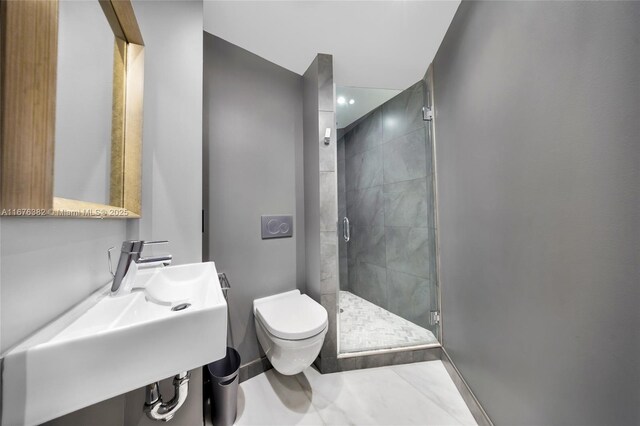 bathroom featuring tile patterned floors, toilet, a shower with shower door, and sink