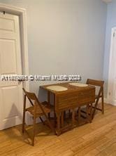 dining space with light wood-type flooring