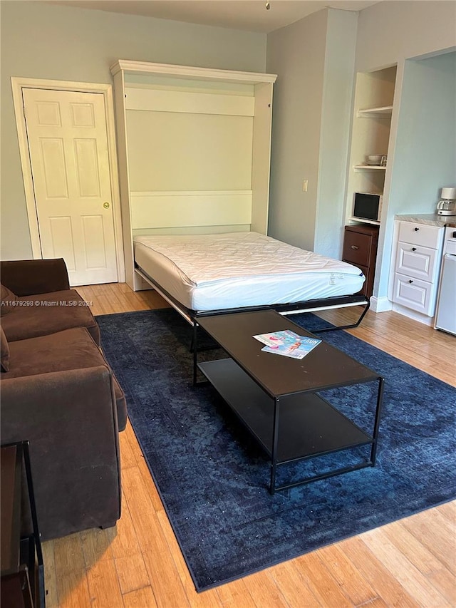 bedroom with light hardwood / wood-style flooring