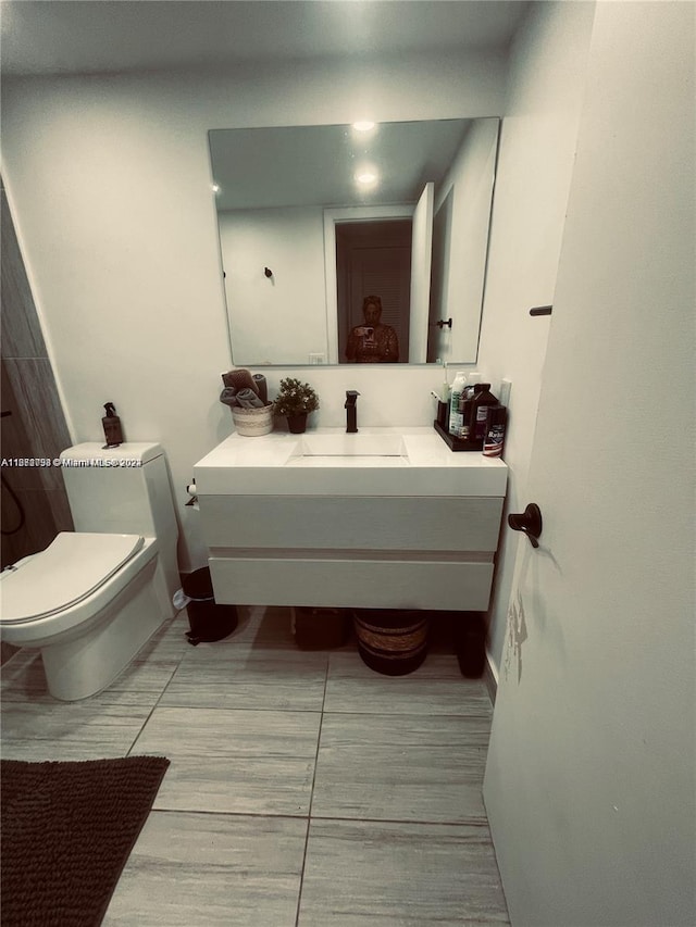 bathroom featuring vanity and toilet