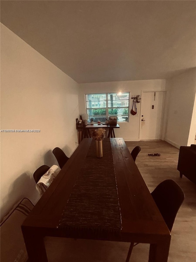 dining space with light hardwood / wood-style flooring