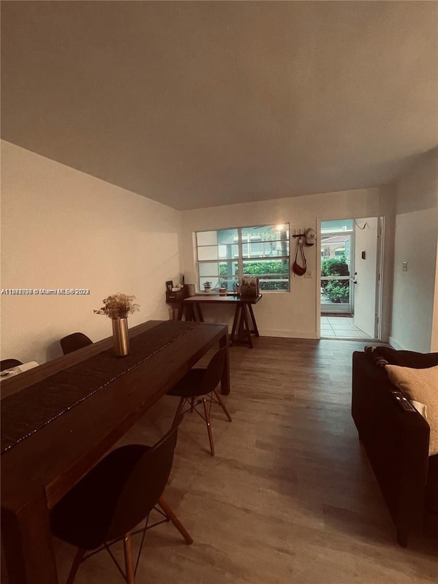 dining space with hardwood / wood-style flooring