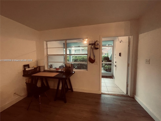 dining space featuring wood-type flooring