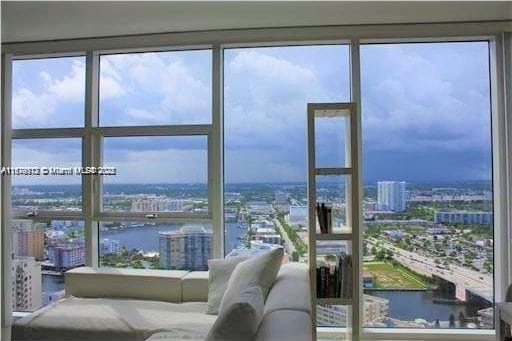 1830 S Ocean Dr Unit 3307, Hallandale Beach, FL 33009 - living area featuring a city view, a water view, and healthy amount of natural light