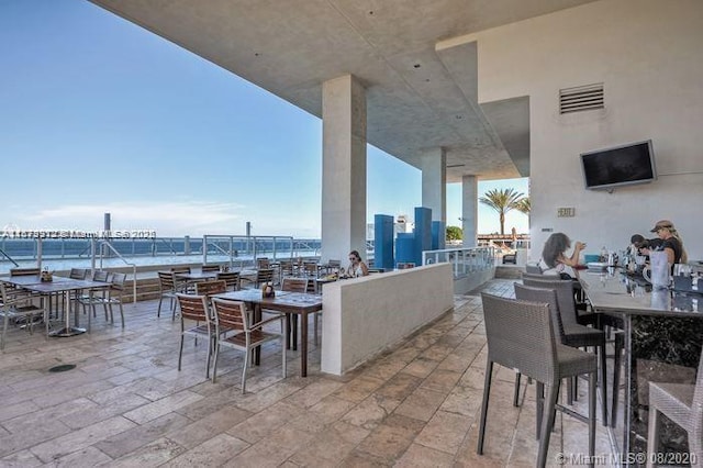 1830 S Ocean Dr Unit 3307, Hallandale Beach, FL 33009 - view of patio / terrace with a water view and outdoor dining space