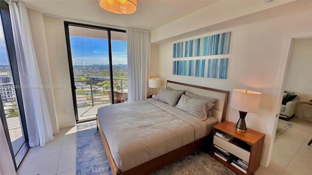 tiled bedroom featuring access to outside