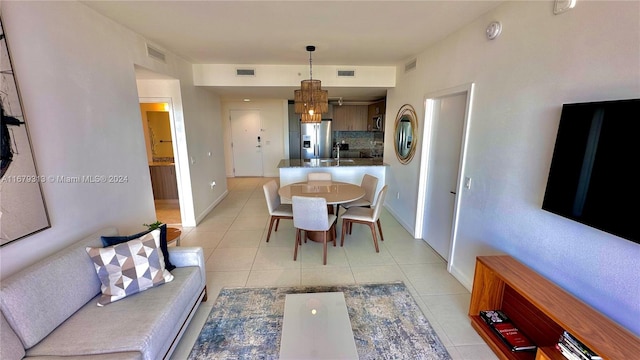 dining area with light tile patterned floors