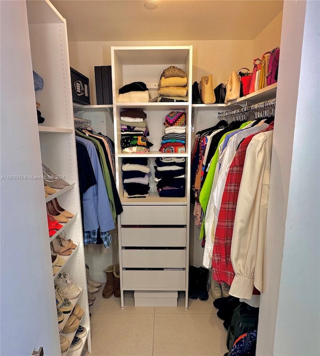 spacious closet featuring tile patterned flooring