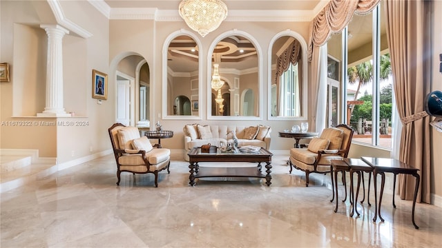 sunroom / solarium featuring decorative columns and a chandelier