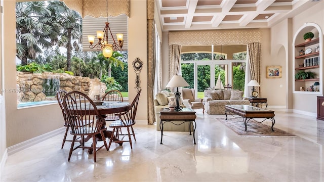 living area with a notable chandelier, beam ceiling, coffered ceiling, and a wealth of natural light