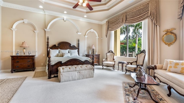 bedroom featuring light carpet, crown molding, and ceiling fan