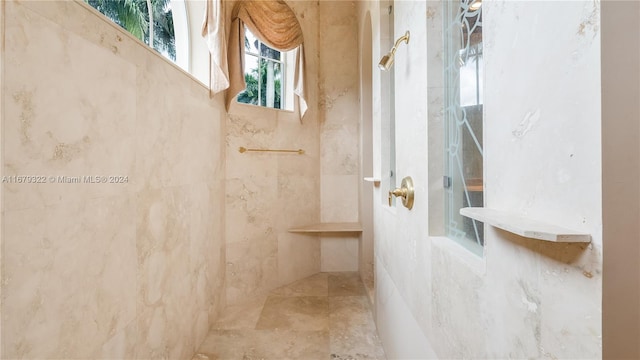 bathroom featuring tiled shower