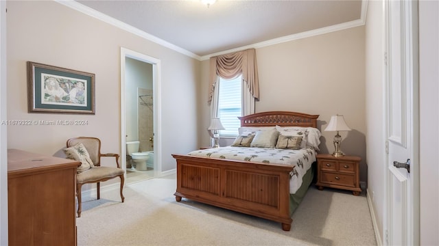 carpeted bedroom featuring crown molding and ensuite bath