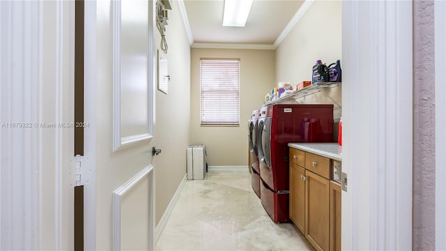 laundry area featuring radiator, crown molding, and separate washer and dryer