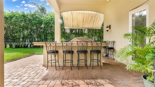 view of patio featuring a bar