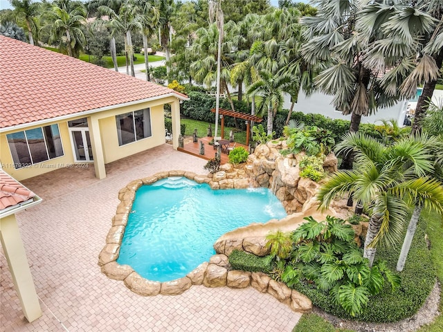 view of swimming pool with a patio area and a pergola