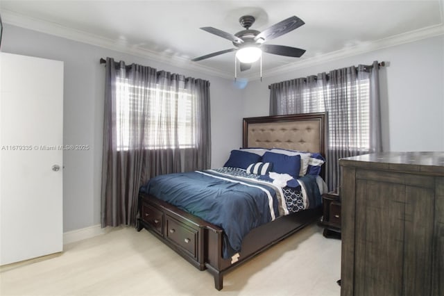 bedroom with ceiling fan and crown molding