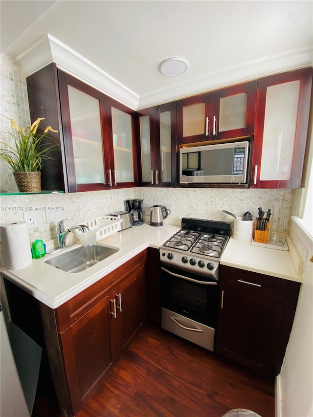 kitchen with sink, decorative backsplash, stainless steel appliances, and dark hardwood / wood-style floors