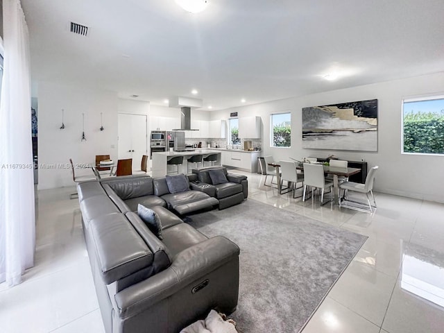 living room with light tile patterned flooring