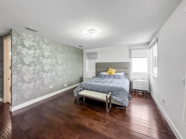 bedroom featuring dark wood-type flooring