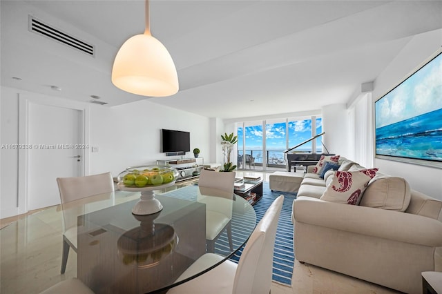 living room with floor to ceiling windows