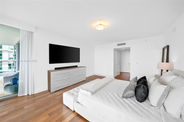 bedroom with wood-type flooring