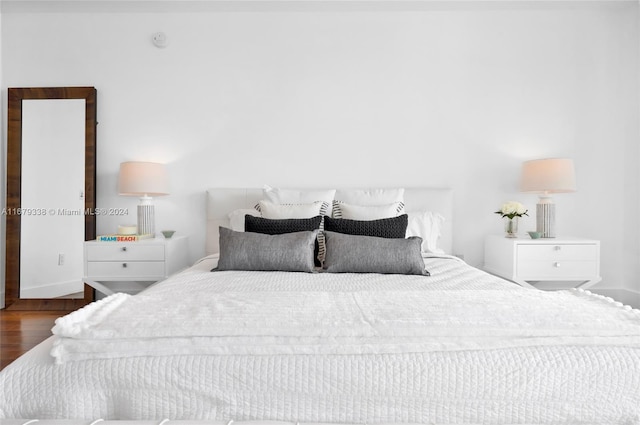 bedroom featuring dark hardwood / wood-style flooring