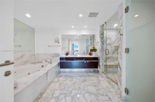 bathroom featuring vanity and shower with separate bathtub