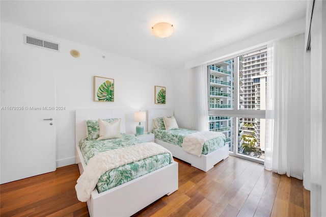 bedroom with hardwood / wood-style flooring