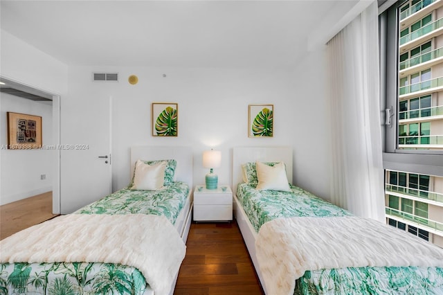 bedroom featuring dark hardwood / wood-style floors