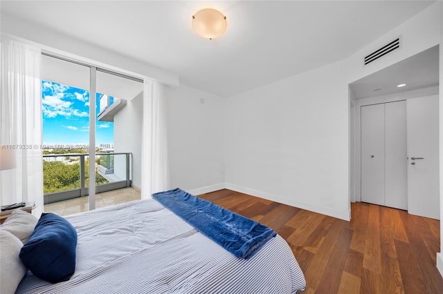 bedroom with hardwood / wood-style flooring