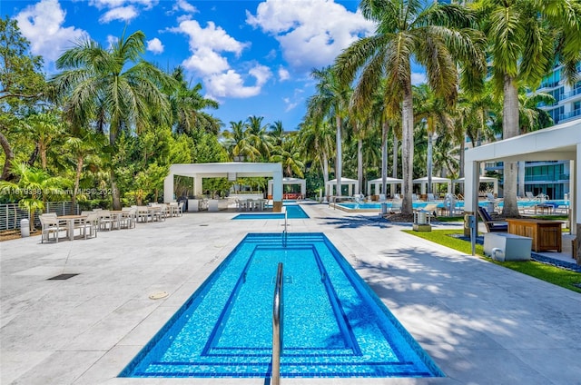 view of swimming pool featuring a patio