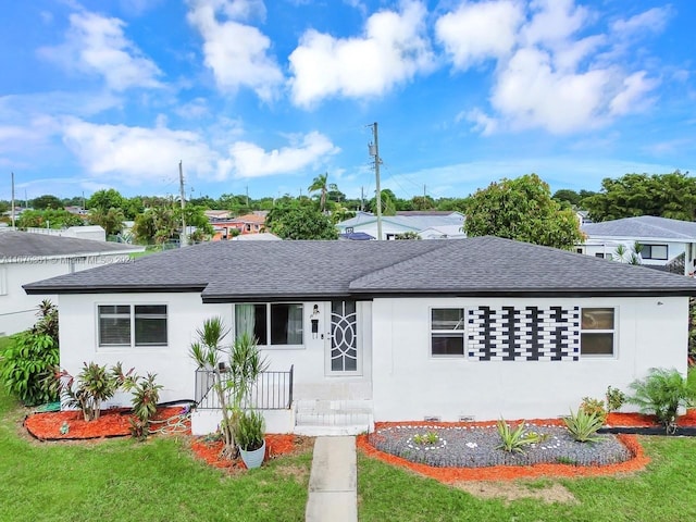 view of front of property with a front lawn