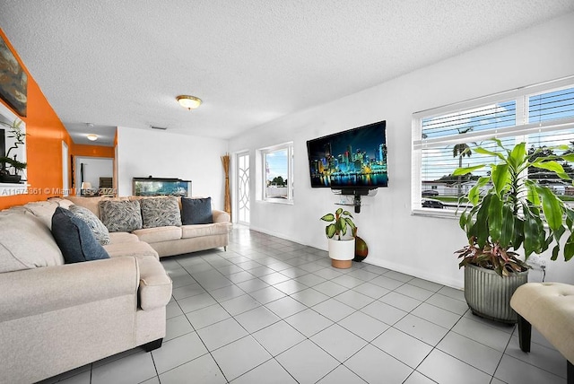 tiled living room featuring a textured ceiling