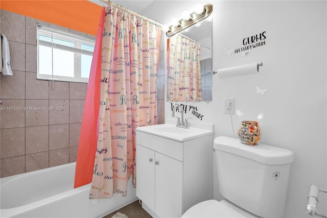 full bathroom featuring vanity, toilet, and shower / tub combo with curtain