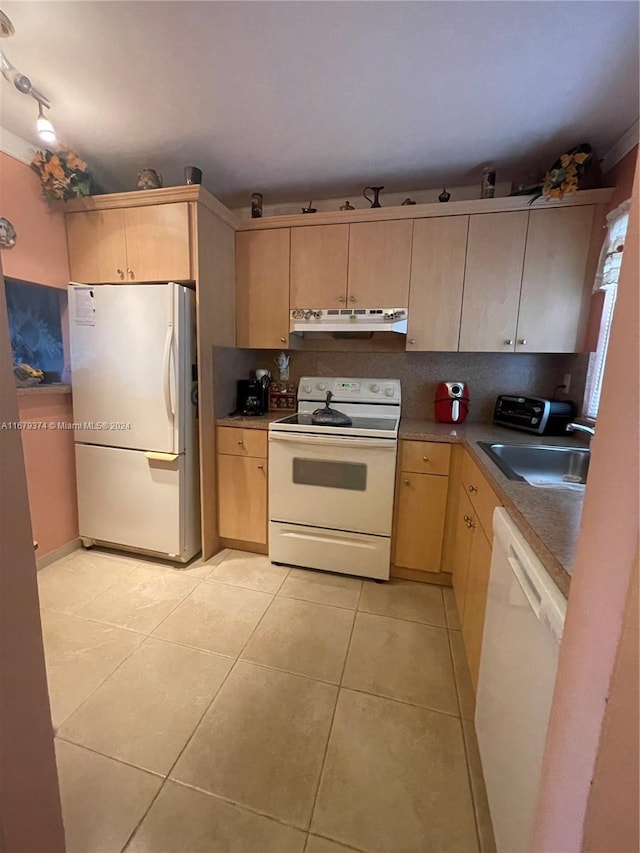 kitchen featuring light tile patterned flooring, light brown cabinets, sink, and white appliances