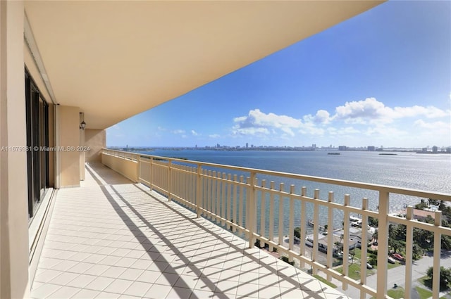 balcony featuring a water view