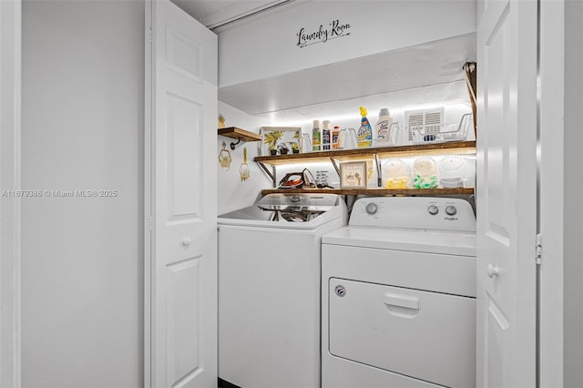 laundry room with washing machine and dryer