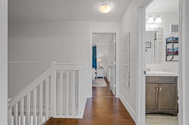 hall featuring dark wood-type flooring