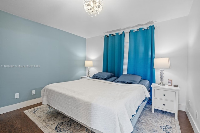 bedroom with wood-type flooring