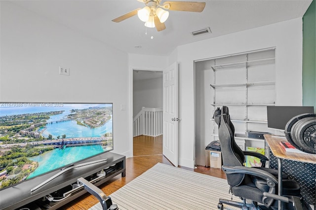 office featuring ceiling fan and light hardwood / wood-style flooring