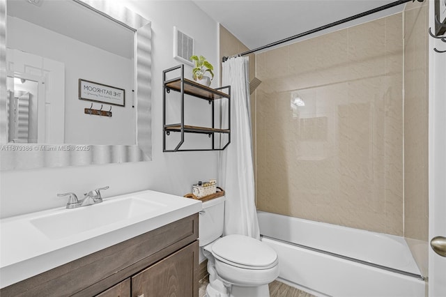 full bathroom with vanity, shower / bath combo with shower curtain, and toilet